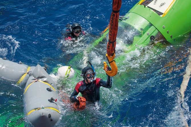 Image from the Cameron Case Study that shows two divers using flotation bags in a heavy salvage operation
