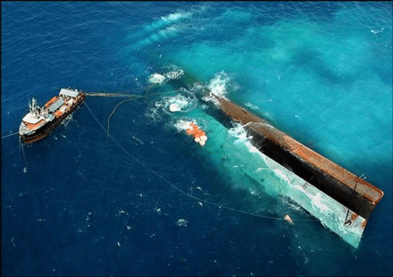 Aerial view of Professional Lift Bags being used to surface and suspend the Spiegel Grove, a 510 ft Navy troop transport ship